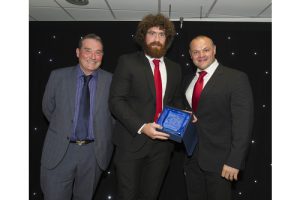 Rugby Star With Award